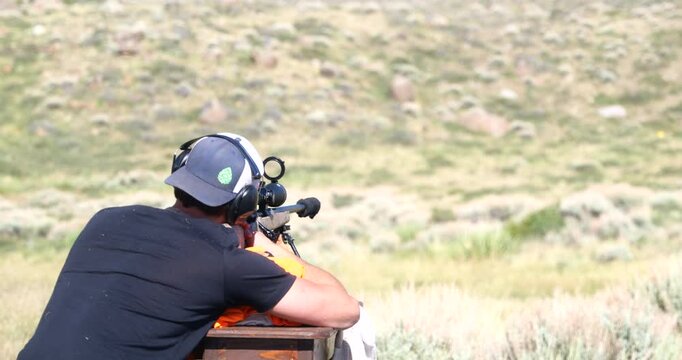 Close-up of a sniper rifle being fired during a military training exercise