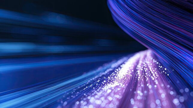 Abstract light streaks and glowing particles flow through a dark, digital tunnel