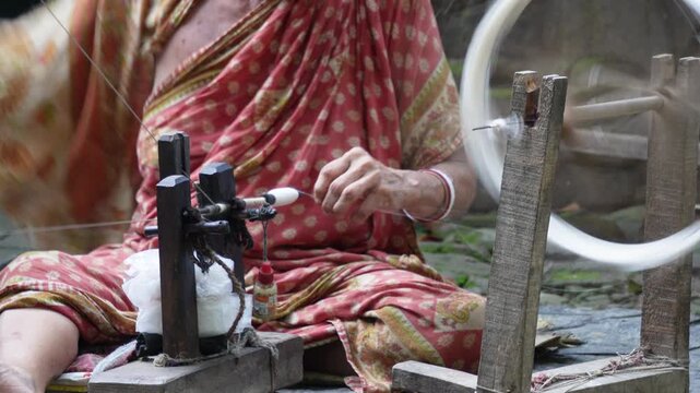 Traditional charkha spinning wheel used to make thread from raw fiber