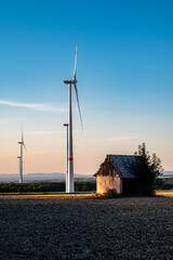 Clean Energy Wind Turbines in Rural Landscape Under Blue Sky © nikolay