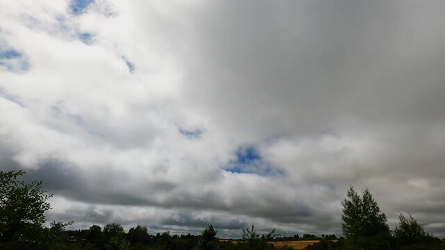 Heavy Rain Clouds Approaching Over the Horizon Timelapse
