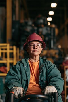 Senior factory worker portrait in hard hat and safety glasses for workplace safety poster and recruitment background design