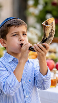 Young boy blowing shofar during Rosh Hashanah celebration, Jewish New Year prayer ritual, traditional horn call beside festive table with apples honey, Yom Kippur synagogue preparation