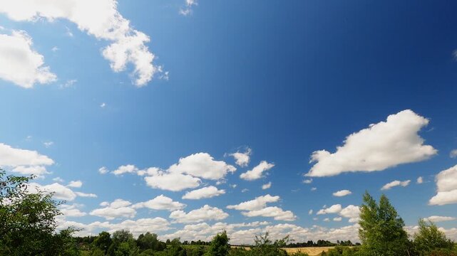 White Cumulus Clouds Changing Shape Over Distant Horizon Under Sunny Summer Sky, Atmospheric Timelapse