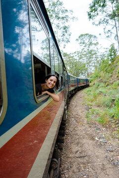 Woman Enjoys Train Ride. Sri Lanka