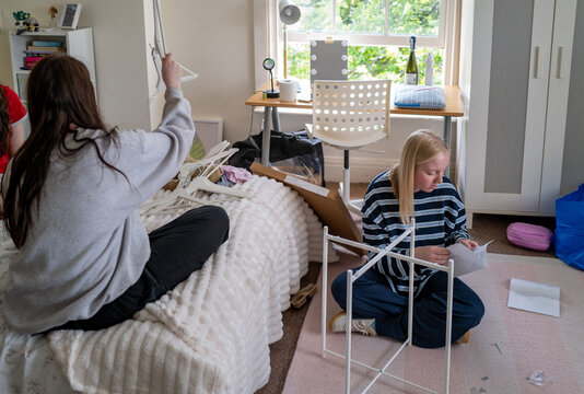 Gen Z girlsin one of the bedrooms of a shared house