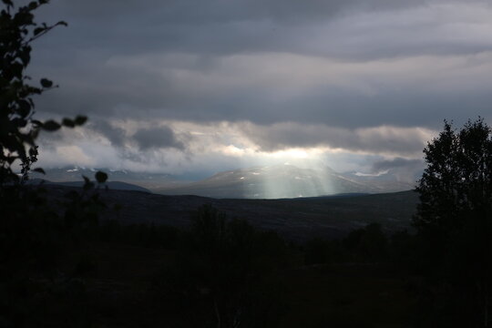 Sunshine coming trough the Clouds in Norwegian Fjord