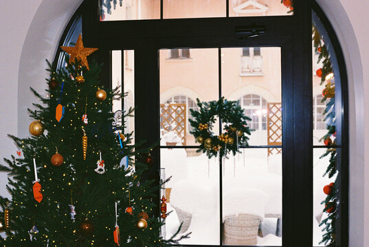 Christmas tree decorating garland and toys at home.
