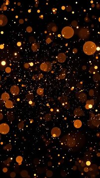 Golden bokeh particles floating and drifting through dark space with depth of field, slow shimmer and abstract festive glowing background