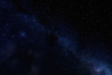 Fototapeta premium Cosmic night: expansive black space filled with twinkling stars and faint nebulae