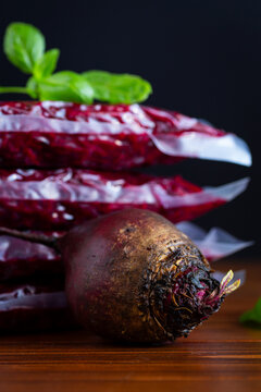 Fresh grated beet in sealed bags for freezing on wooden table