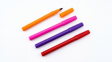 Fototapeta premium Vibrant colorful felt tip pens arranged in diagonal lines for creative artistic projects on white background