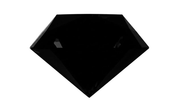 Spinning black diamond gemstone showing facets and brilliance against white background