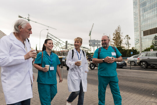 Healthcare professionals walking together during coffee break