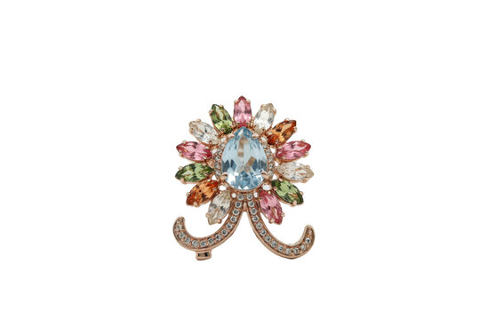 Floral shaped brooch featuring a large central blue topaz surrounded by marquise cut multi-colored gemstones isolated on a transparent background