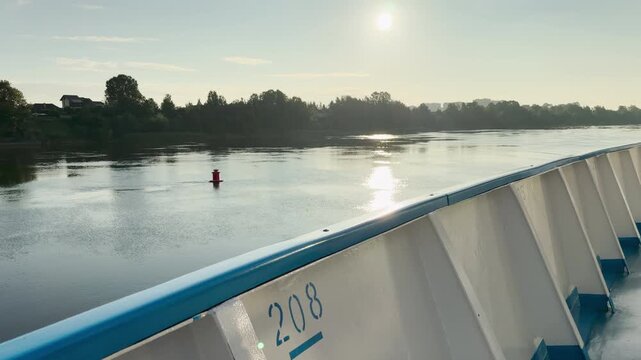 A cruise ship sails calmly along the Neva River in Saint Petersburg. This serene journey evokes peaceful and happy feelings as you enjoy the bright, scenic water view.