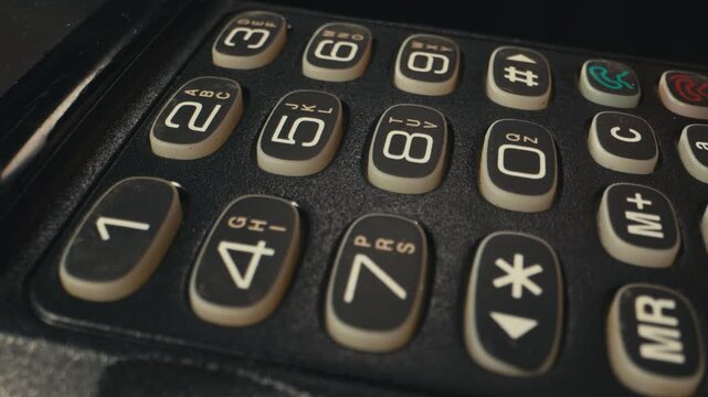 Vintage mobile phone from the 90s close up retro cellphone old technology device