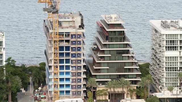 Aerial tight shot Surf House Surfside Miami Florida under construction next to Arte building