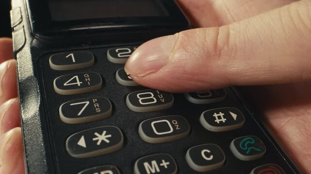 Vintage mobile phone from the 90s close up retro cellphone old technology device