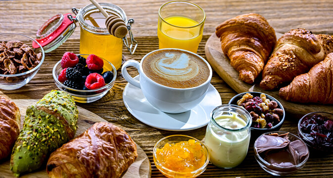 Italian breakfast served with croissants orange juice and coffee