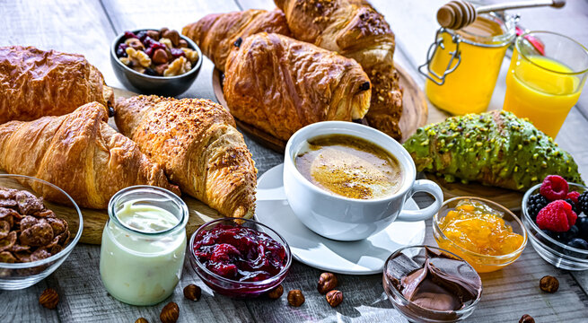 Italian breakfast served with croissants orange juice and coffee