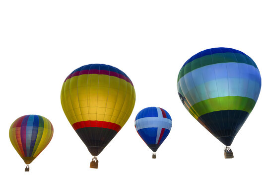four colorful hot air balloons are floating