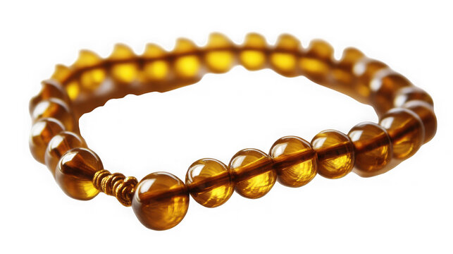 A circular strand of translucent amber prayer beads with circular string polished golden amber beads decorative knotted cord isolated white background close up traditional symmetrical meditation