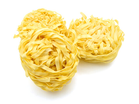 Egg noodles on a white background