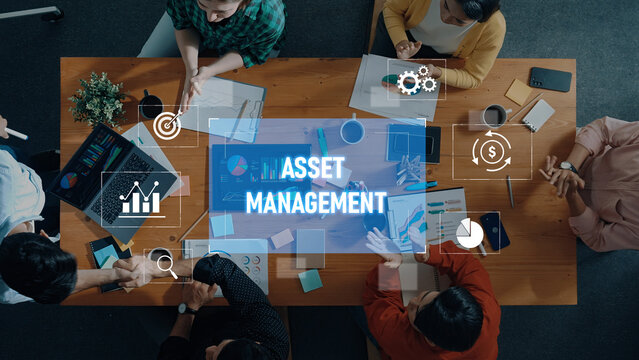A dynamic scene of professionals collaborating on asset management in a modern office setting, utilizing data visualizations and strategic discussions to drive financial success. Trope