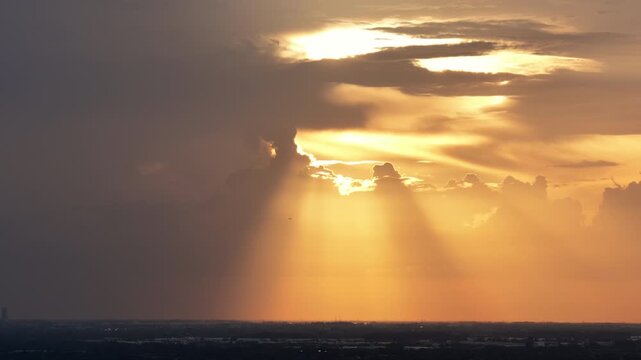 Golden sunset through the clouds