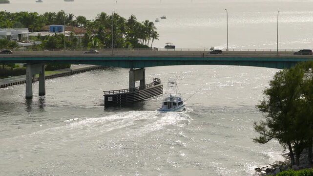 Fishing boat going through Haulover inlet Miami stock footage