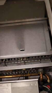 Vertical screen gas boiler flame burns then suddenly goes out symbolizing gas shortage and disrupted home heating as fuel supply problems leave households without warmth