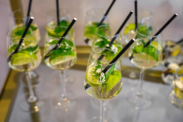 drinks to be Hugo Spritz cocktails, which typically consist of prosecco, elderflower liqueur, soda water, fresh mint, and lime. © nedomacki