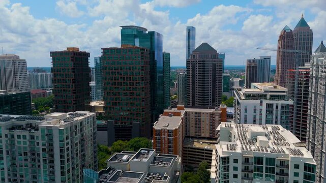 Aerial Drone Pullback Shot Gliding Between Midtown Atlanta High-Rise Skyscrapers On Sunny Summer Day