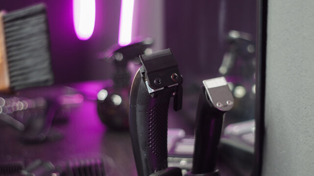 Professional hairdressing accessories and tools on beauty salon workspace tabletop