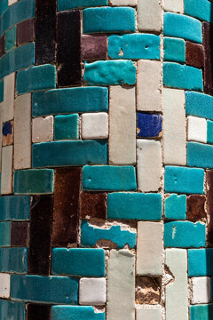 Close-up of aged blue Samarkand ceramic tiles background in an irregular geometric pattern, Uzbek texture and materials