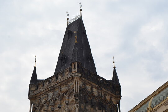Powder tower rooftop close up in prague gothic landmark for travel background and historical architecture poster