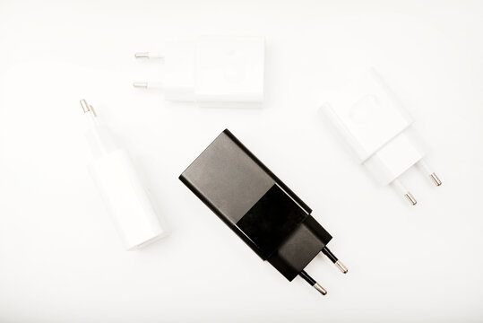 Black and white power supplies for mobile devices. Powerful power supplies on a white background. Charging devices for gadgets.
