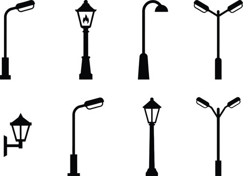 Set of black silhouettes representing various types of street lamps, lanterns, and outdoor lighting fixtures on a white background