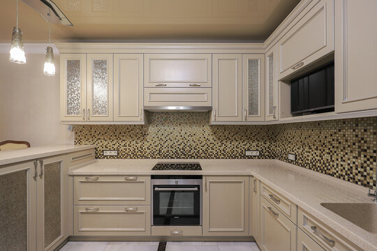Classical beige kitchen cabinets mosaic backsplash