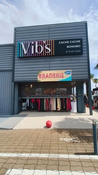 Royan, France - August 10, 2026: New Aquitaine, Charente-Maritime, Centre commercial. Vibs clothing store exterior featuring colorful signage and clothing display in shopping center