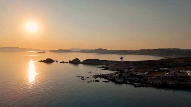Aerial drone view over Mandrakia village near Sarakiniko beach on the Greek island Milos in Greece during sunrise. Unique rock formations of the coastline. 