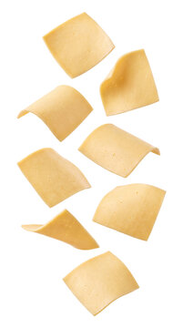 Falling slices of yellow cheese isolated on transparent background