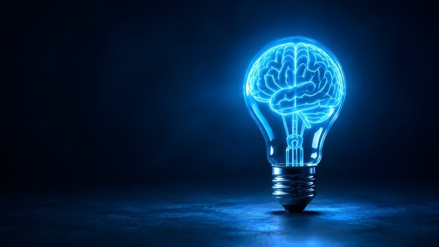 Glowing blue lightbulb containing a digital human brain on dark background representing artificial intelligence creative thinking and advanced technological ideas