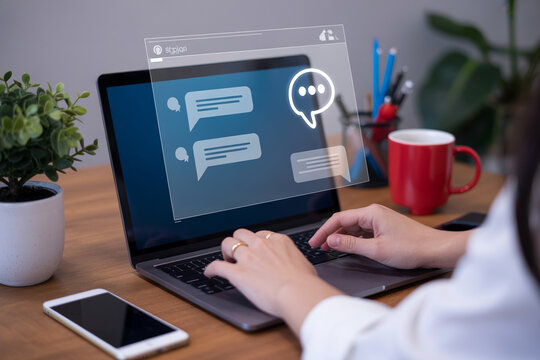 Woman typing on laptop computer with digital chat application interface overlay.