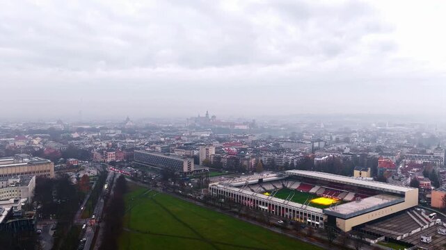Aerial view of Marshal Jozef Pilsudski Stadium with its green pitch and surrounding urban landscape in Krakow, Lesser Poland Voivode, Poland.