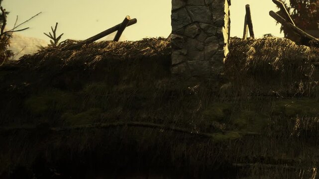 The scene shows a close view of a grass roof with a stone chimney during sunset. Shadows stretch across the roof and the sun casts warm light on the structure.