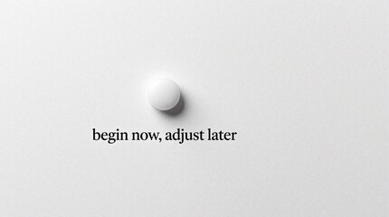 Naklejka premium White pill sits on plain background. Text reads begin now, adjust later. Minimalist composition for health, wellness, or decision-making concepts. Clean studio shot.