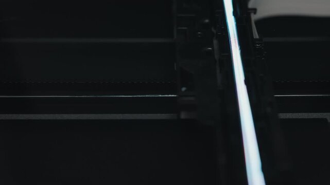 Scanner head moving across document during scanning process