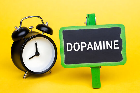 Bright green dopamine signboard with alarm clock symbolizing motivation and productivity